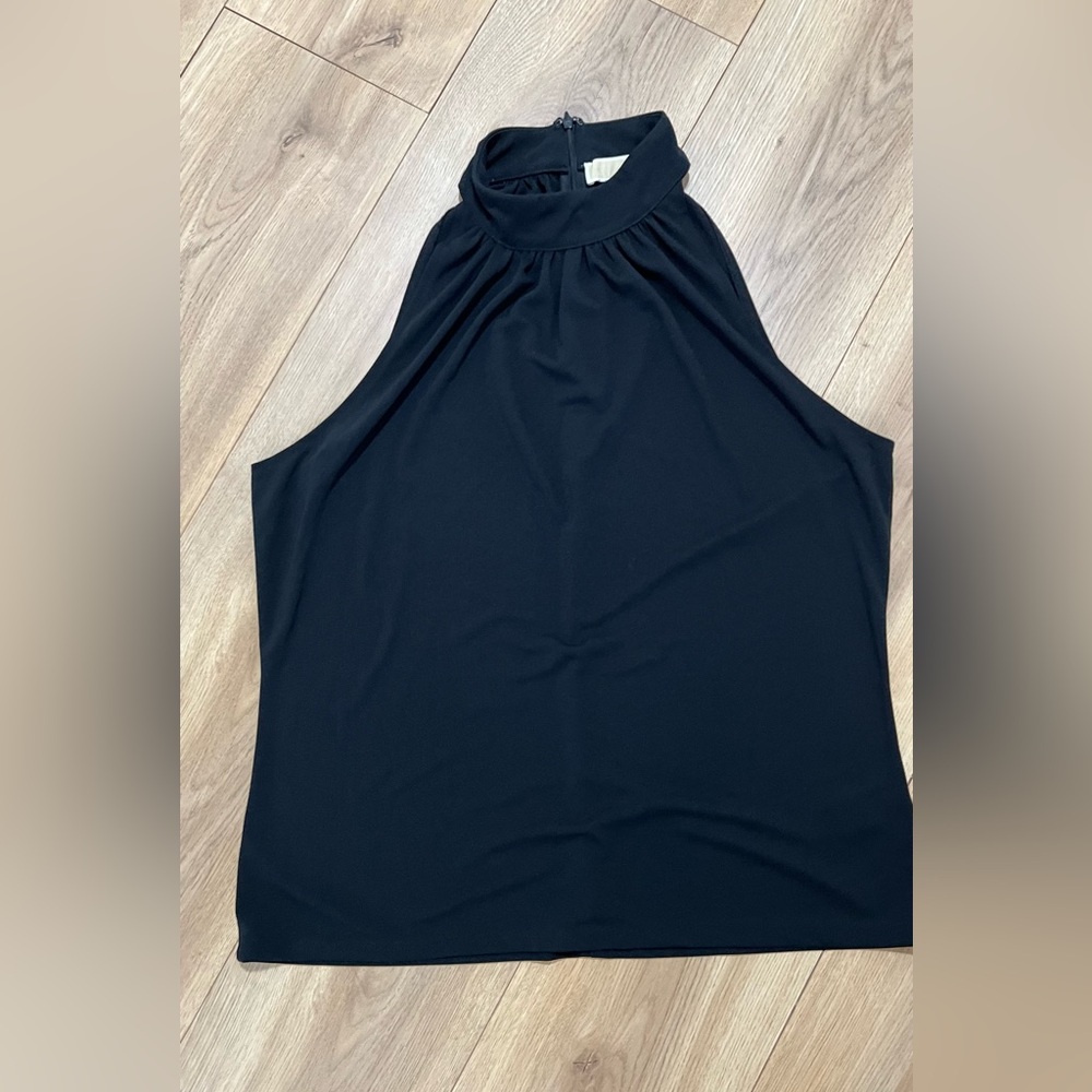 MK turtleneck blouse
